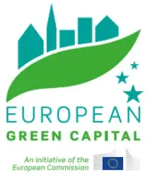 Icono con silueta de edificios verdes y una hoja verde